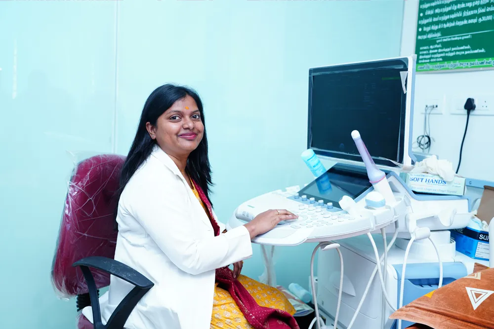 A fetal medicine specialist at the ultrasound machine inside Trichy Fetal Medicine and Fertility Centre
